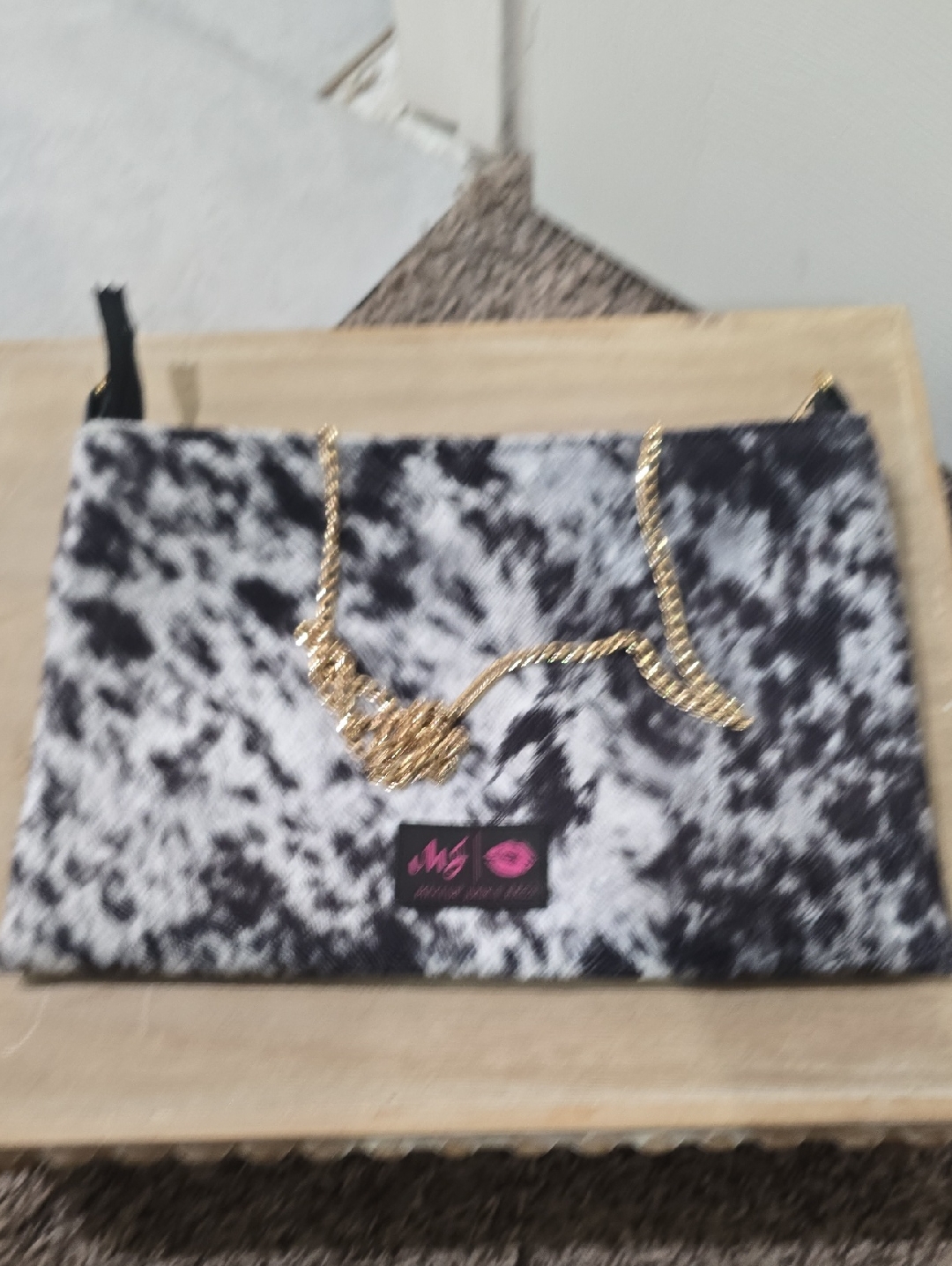 Black & White Patterned Clutch With Gold Chain Strap